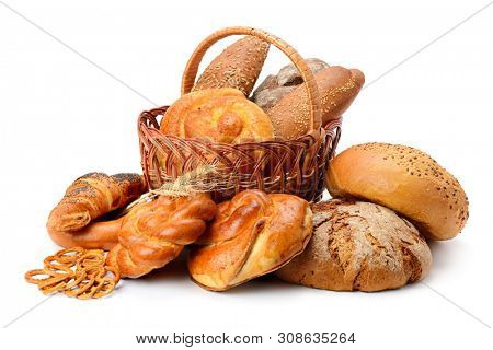 Fresh bread, buns and cookies in basket isolated on white background
