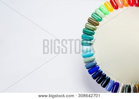 Summer Manicure And Nail Color Samples. Multicolored Manicure And Collection Of Color Nail Polish Sa