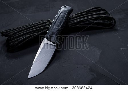Hunting Knife With A Fixed Blade. Knife And Paracord.