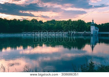 Image Of Reservoir Lake With Water Reflections During Sunset