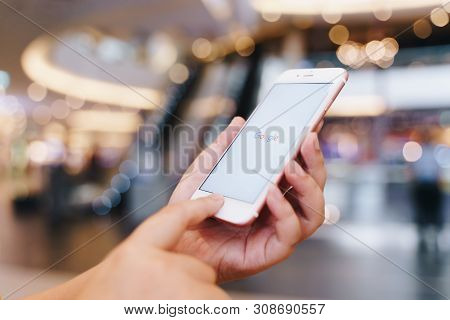 Chiang Mai, Thailand - May.10,2019: Woman Holding Apple Iphone 6s Rose Gold With Google Apps On Scre