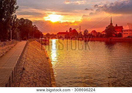 Wroclaw, Poland Sunset Panorama With Ostrow Tumski Island, Odra Or Oder River And Cathedral Towers