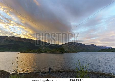 Eilean Munde Or The Burial Island Is A Small Island In Loch Leven In Twilight , Glencoe , Scotland