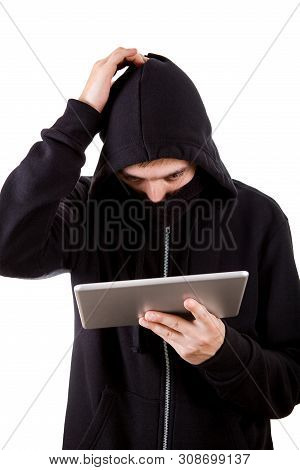 Troubled Hacker With A Tablet Computer On The White Background
