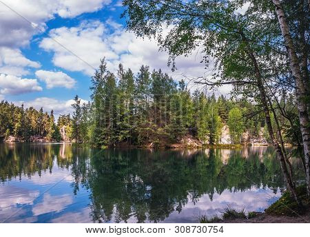 Lake And Ancient Pines Growing Between Them Located In Rock City Adrspach, National Park Of Adrspach