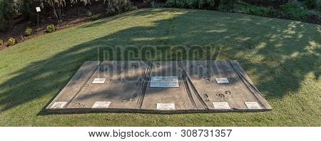 Senekal, South Africa, May 1, 2019: Ox-wagon, People And Ox Tracks Embedded In Concrete During The B