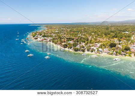 Coast Of Cebu Island, Moalboal, Philippines, Top View. Philippine Boats In A Blue Lagoon Over Coral 