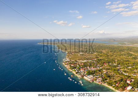 Coast Of Cebu Island, Moalboal, Philippines, Top View. Philippine Boats In A Blue Lagoon Over Coral 