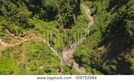 Beautiful Waterfall Coban Sewu In Tropical Forest, Java Indonesia. Aerial View Tumpak Sewu Waterfall
