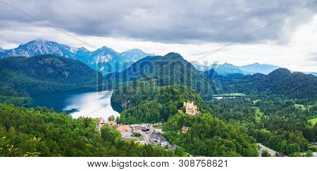 Panorama Of Alps Mountains And Hohen Schwangau Castle In Germany