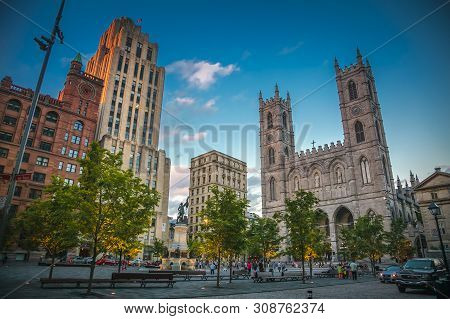 Quebec, Canada, July 2012 - Chomedey Square In Montreal City Dominated By The Basillica Of Notre-dam
