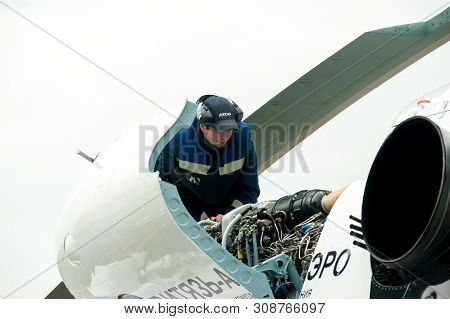 Tyumen, Russia - June 19, 2019: Aircraft Repair Helicopter Utair Engineering Plant. Male Mechanic In
