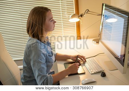 Graphic Designer Sitting At Work. Illustrator. Web Designer. Freelancer