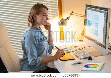 Graphic Designer Sitting At Work. Illustrator. Web Designer. Freelancer