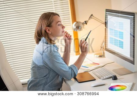Graphic Designer Sitting At Work. Illustrator. Web Designer. Freelancer