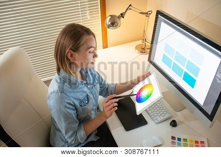 Graphic Designer Works On A Computer Using A Graphic Tablet On A Table. Working With Web Design. Fre