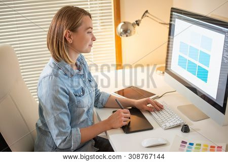 Graphic Designer Sitting At Work. Illustrator. Web Designer. Freelancer