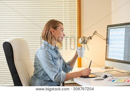 Graphic Designer Works On A Computer Using A Graphic Tablet On A Table. Working With Web Design. Fre