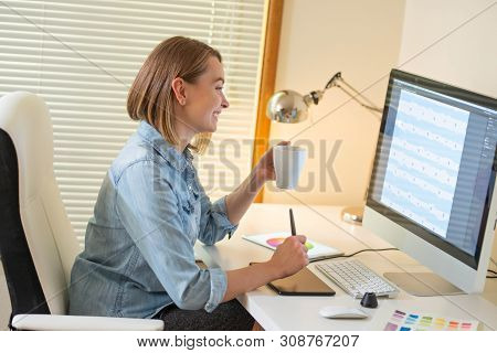 Graphic Designer Sitting At Work. Illustrator. Web Designer. Freelancer