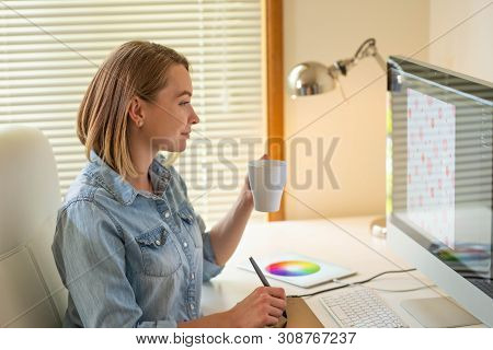 Graphic Designer Works On A Computer Using A Graphic Tablet On A Table. Working With Web Design. Fre