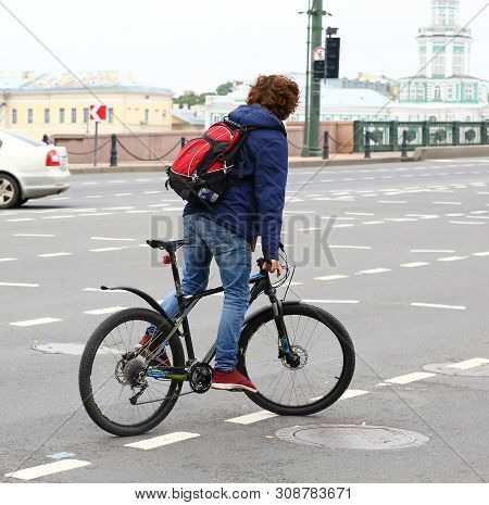 Young Man On A Black Bike, Dvortsoviy Proezd, Saint-petersburg, Russia September 2017