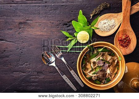 Hot Vegetable Soup With Chicken, Puree, Herbs, Pumpkin Seeds For Lunch Fillet In A Bowl Over Dark Ru