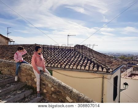 Mother And Daughter Enjoying The Views Of Granada From The Realejo Neighborhood.