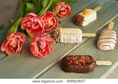 Ice Cream On Wooden Table Dcorated With Pink Tulips