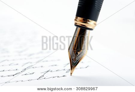 Fountain Pen On Paper With Ink Text On A White Background Closeup
