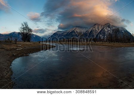 Russia. Mountain Altai. Southern Shore Of Lake Teletskoye Near The Mouth Of The River Chulyshman