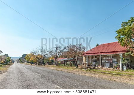Paul Roux, South Africa, May 1, 2019: A Street Scene, With A Business And Houses, In Paul Roux, A Sm