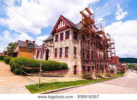 Homestead, Pennsylvania, Usa 6/29/2019 An Old Apartment Building Being Renovated At The Corner Of 10