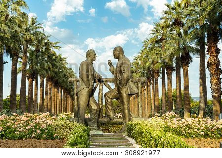 Two Black Men Statue Standing And Talking To Each Other In Public Park Called Kültürpark At Izmir, T