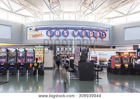 Las Vegas, Nevada, Usa - 13 May, 2019: People Playing Slot Machines At Mccarran International Airpor