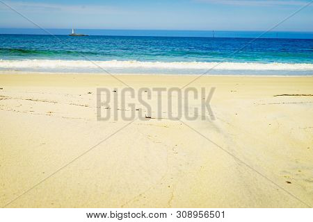 Seascape Sandy Beach Sea Shore With Lighthouse On Horizon. Andoya Island Bleiksstranda Beach. Vester