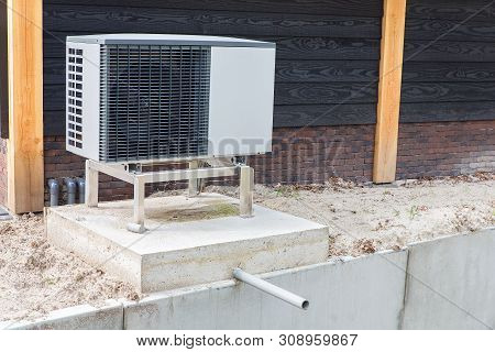 One Solitary Air Conditioning Outside On Concrete