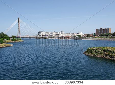 Southport, Merseyside, United Kingdom - 28 June 2019: The Suspension Bridge And Pier Crossing The La