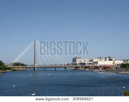 Southport, Merseyside, United Kingdom - 28 June 2019: The Suspension Bridge And Pier Crossing The La