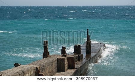 Veiw Of Breackwater In The Crimea, Sea Landscape. Blue Waves In The Sun
