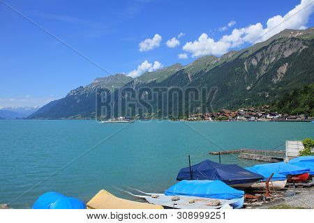 Boats On The Shore Of Lake Brienz.