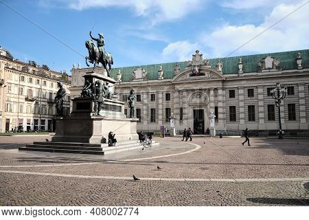 Turin, Italy -february 2021: The National Library Of Piazza Carlo Alberto With The Equestrian Statue
