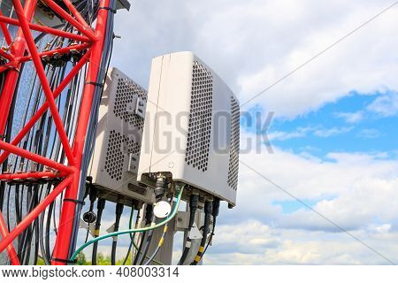 Telecommunications Signal Emitter Close-up Mounted On A Mast Against The Sky