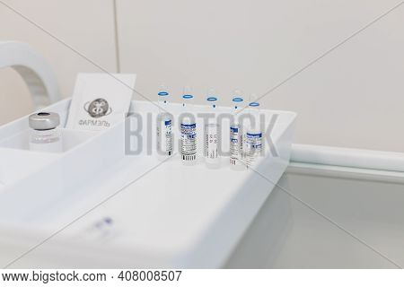 Omsk, Russia, February 9, 2021.sputnik Vaccine. Vaccine Ampules Known As Sputnik V.ampules With Russ