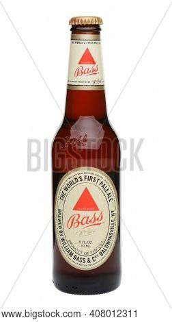IRVINE, CA - MAY 27, 2014: A single bottle of Bass Pale Ale on white. The Bass Brewery founded in 1777 by William Bass, in Trent, England is now owned by Anheuser-Busch InBev.