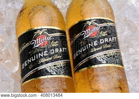 IRVINE, CA - MAY 27, 2014: Two Bottles of Miller Genuine Draft, on ice. MGD is actually made from the same recipe as Miller High Life except it is cold filtered.