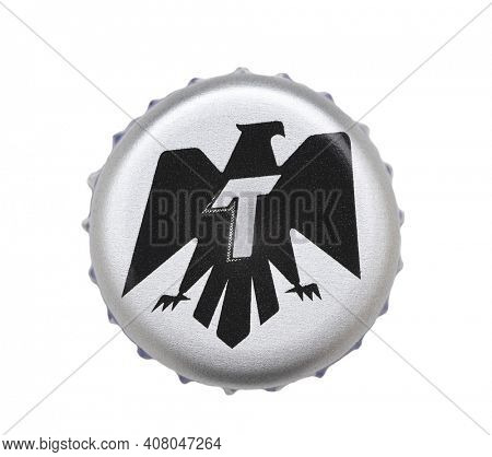 IRVINE, CALIFORNIA - 4 JUNE 2020: Closeup of a Tecate beer bottle cap on white.