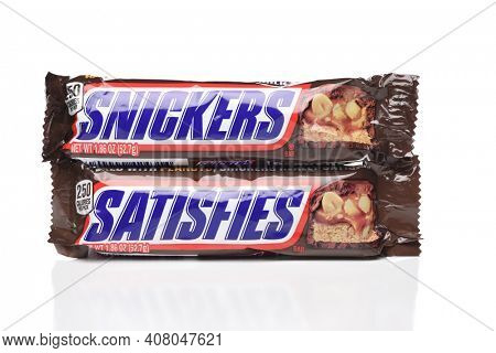 IRVINE, CALIFORNIA - 6 OCT 2020: Two Snickers Candy Bars from Mars, one says Snickers the other label reads Satisfies.