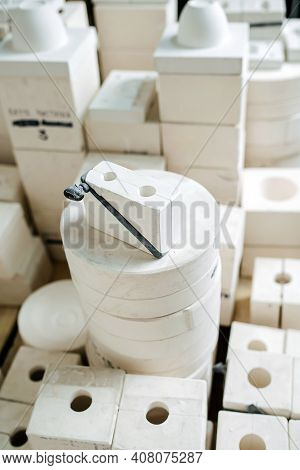 High Angle View On A Stack Of Molds For Casting Tableware Of Different Shape.