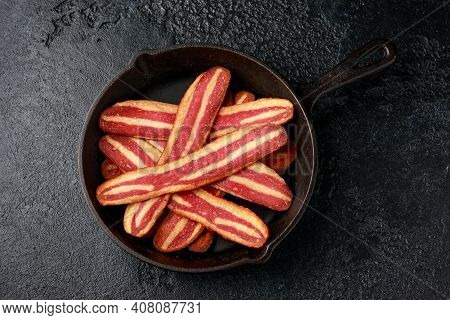 Fried Crunchy Plant Based Vegan Bacon Pieces In A Cast Iron Skillet