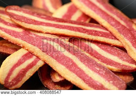 Fried Crunchy Plant Based Vegan Bacon Pieces In A Cast Iron Skillet